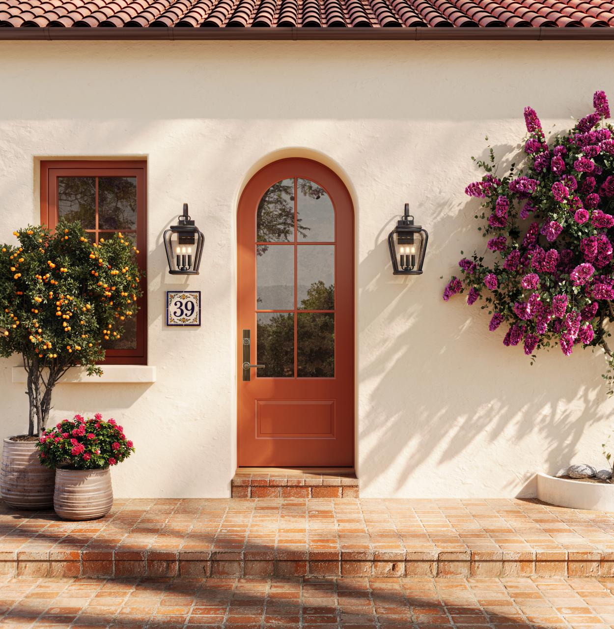 Radius-top Resilient FL619-ES401 entry system with clear glass on a Mediterranean-style home.