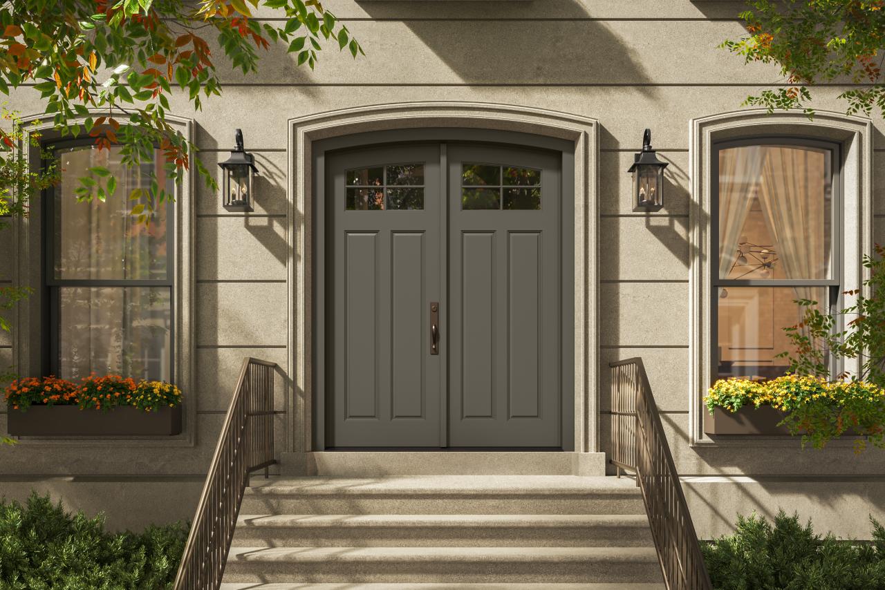 PL254-ES501 Resilient Wood Entry System with Cove & Bead sticking, Scoop panels, and clear glass, featured as a traditional double-door entrance with stone surrounds and decorative lanterns.
