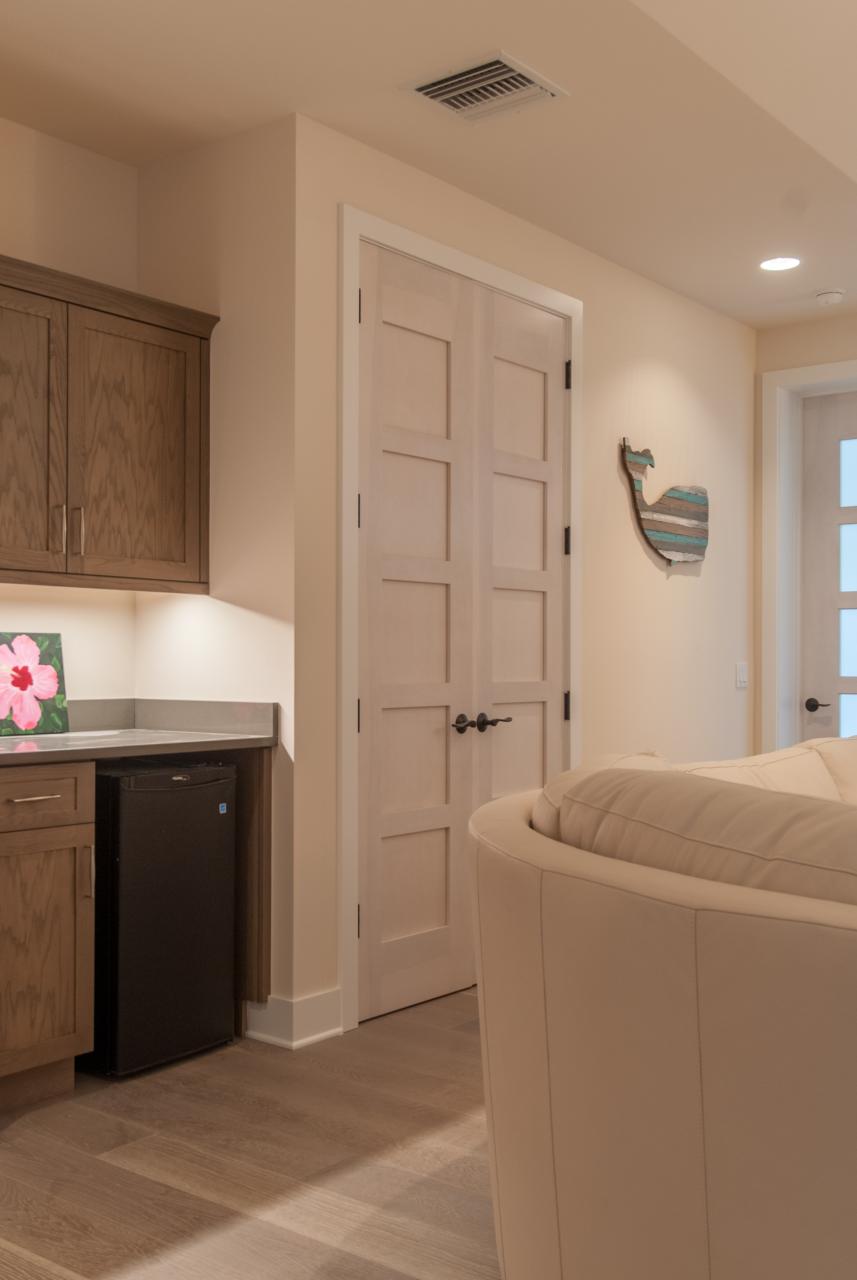 The custom whitewash finish of these birch TM5000 doors ties in with the pastel color scheme of the home.