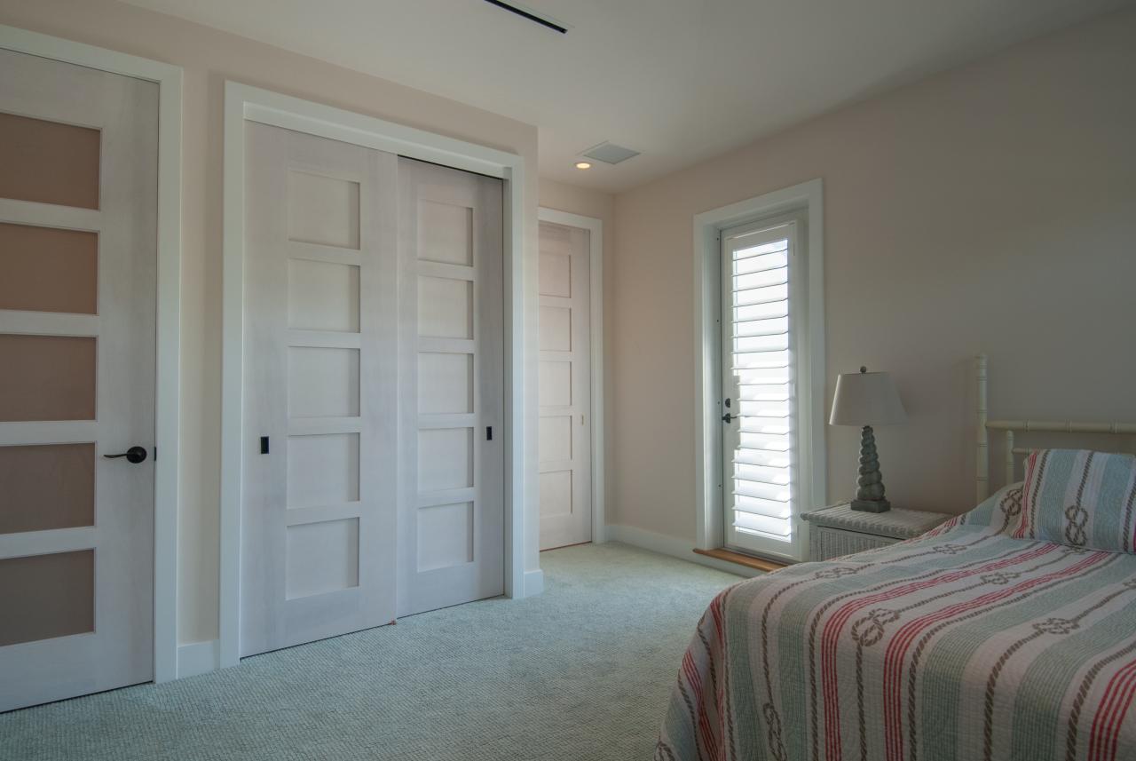 The custom whitewash finish of these birch TM5000 doors ties in with the pastel color scheme of the home.