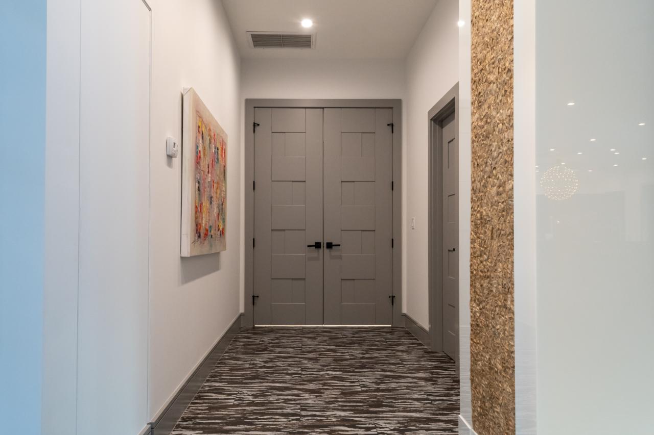 A pair of TM9420 doors in MDF open to the master bedroom.