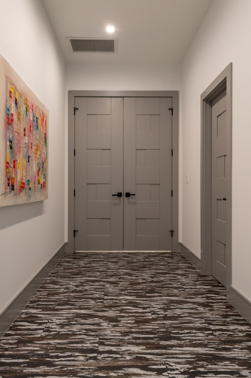 A pair of TM9420 doors in MDF open to the master bedroom.