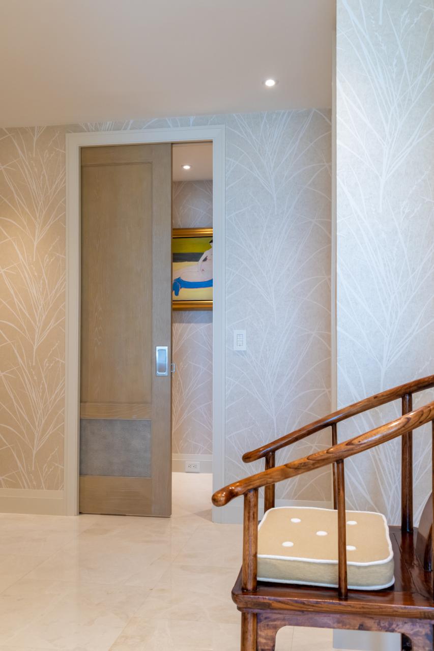 This master bedroom suite features modified TS2210 doors in wire-brushed plain sawn white oak with customer-applied ceruse finish and Shagree Grey Oyster leather.