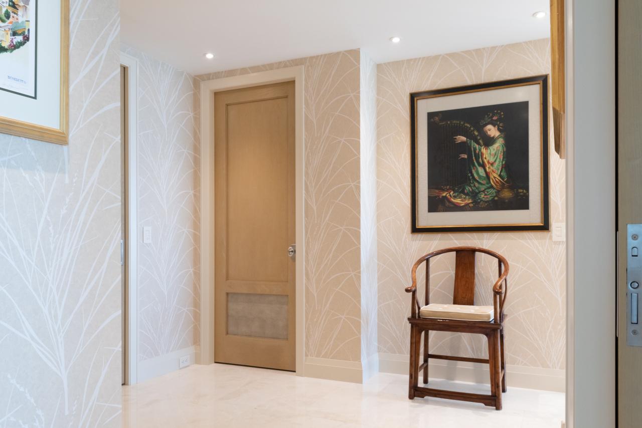 This master bedroom suite features modified TS2210 doors in wire-brushed plain sawn white oak with customer-applied ceruse finish and Shagree Grey Oyster leather.