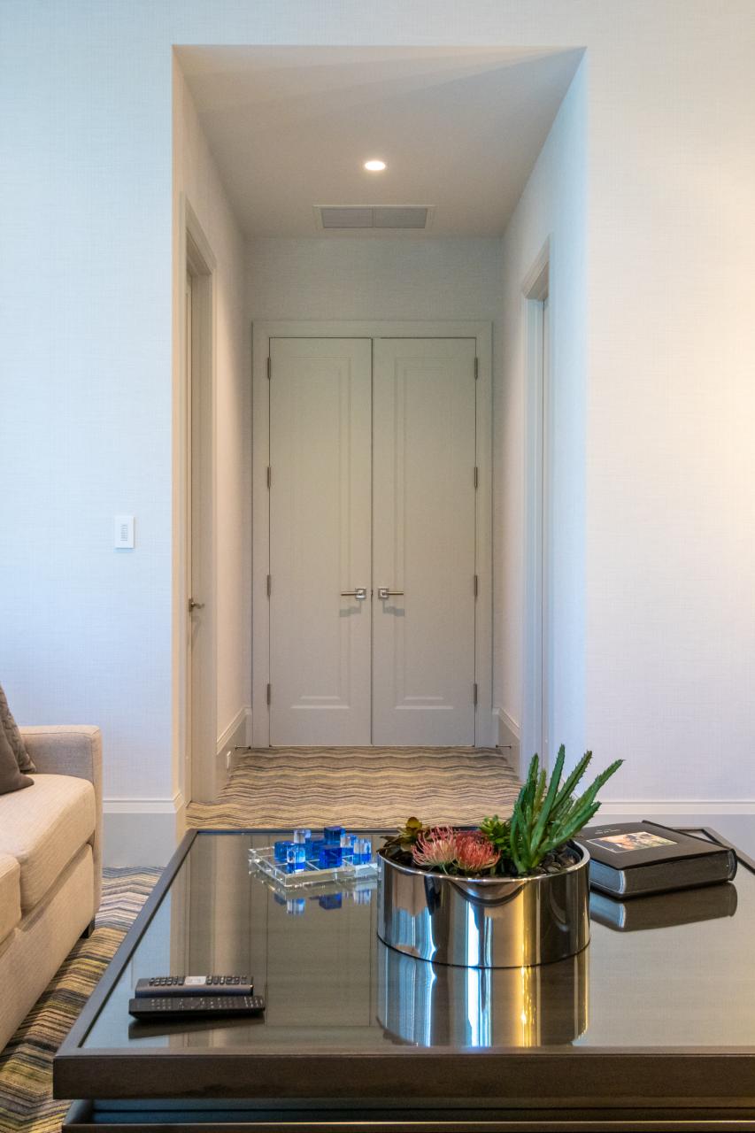 A pair of TS1000 doors, in MDF with Miracle (MR) moulding and flat (C) panel, provide privacy for the family room.