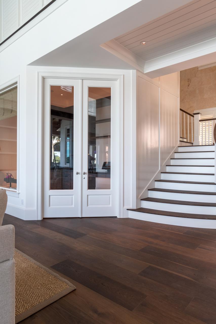 A study next to the living room features a pair of FL110 doors in MDF with Roman Ogee (OG) sticking, Raised (A) panel and clear glass.