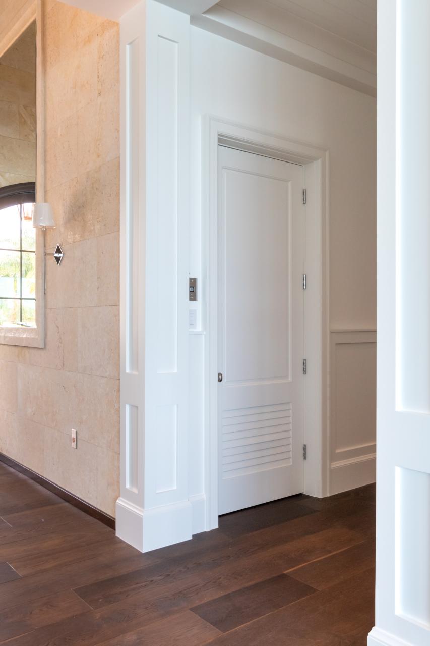 The elevator on this coastal home features a TS2060 in MDF with Roman Ogee (OG) sticking and Raised (A) panel. The bottom panel has been switched to a false louver panel.