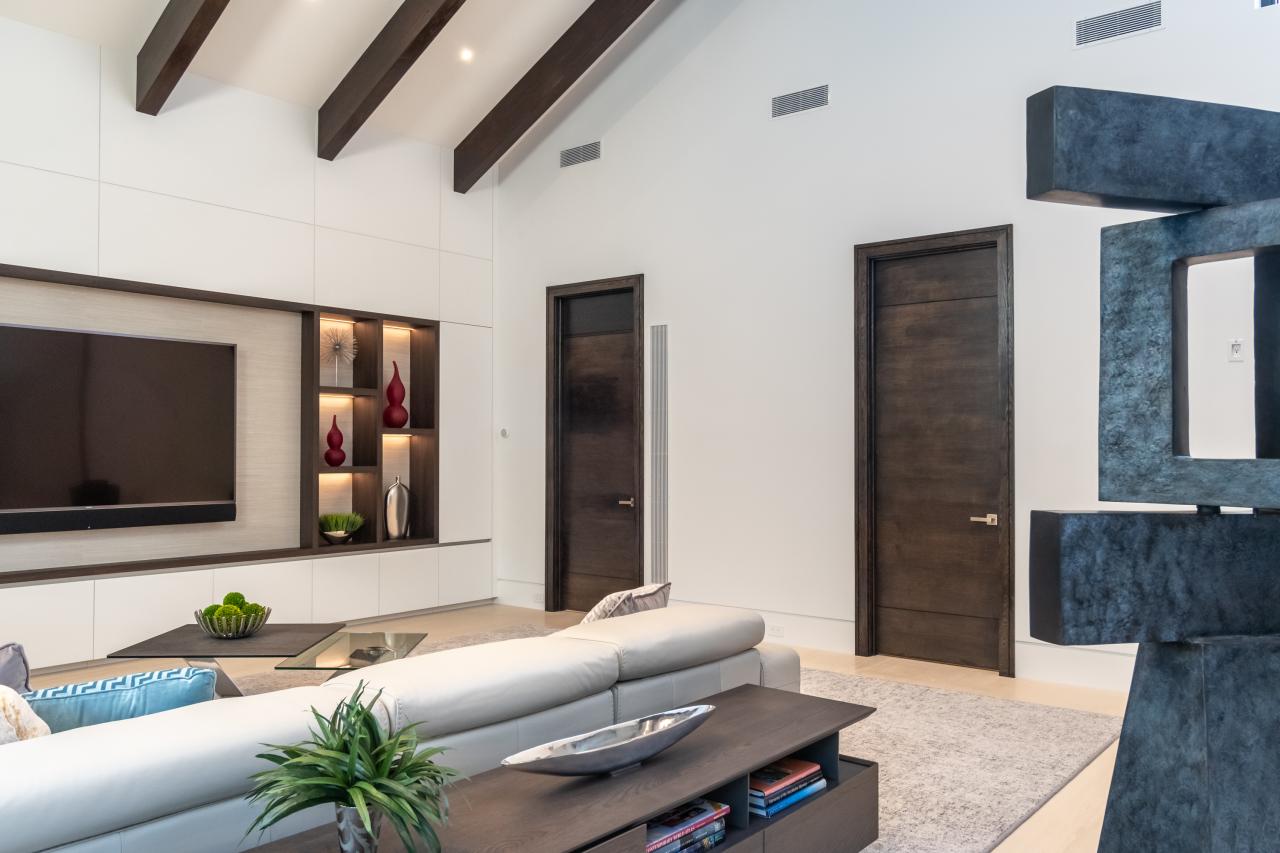 Family room with TMIR3080 doors in quarter sawn white oak with ¼" kerf cut reveals. Builder provided stain finish.