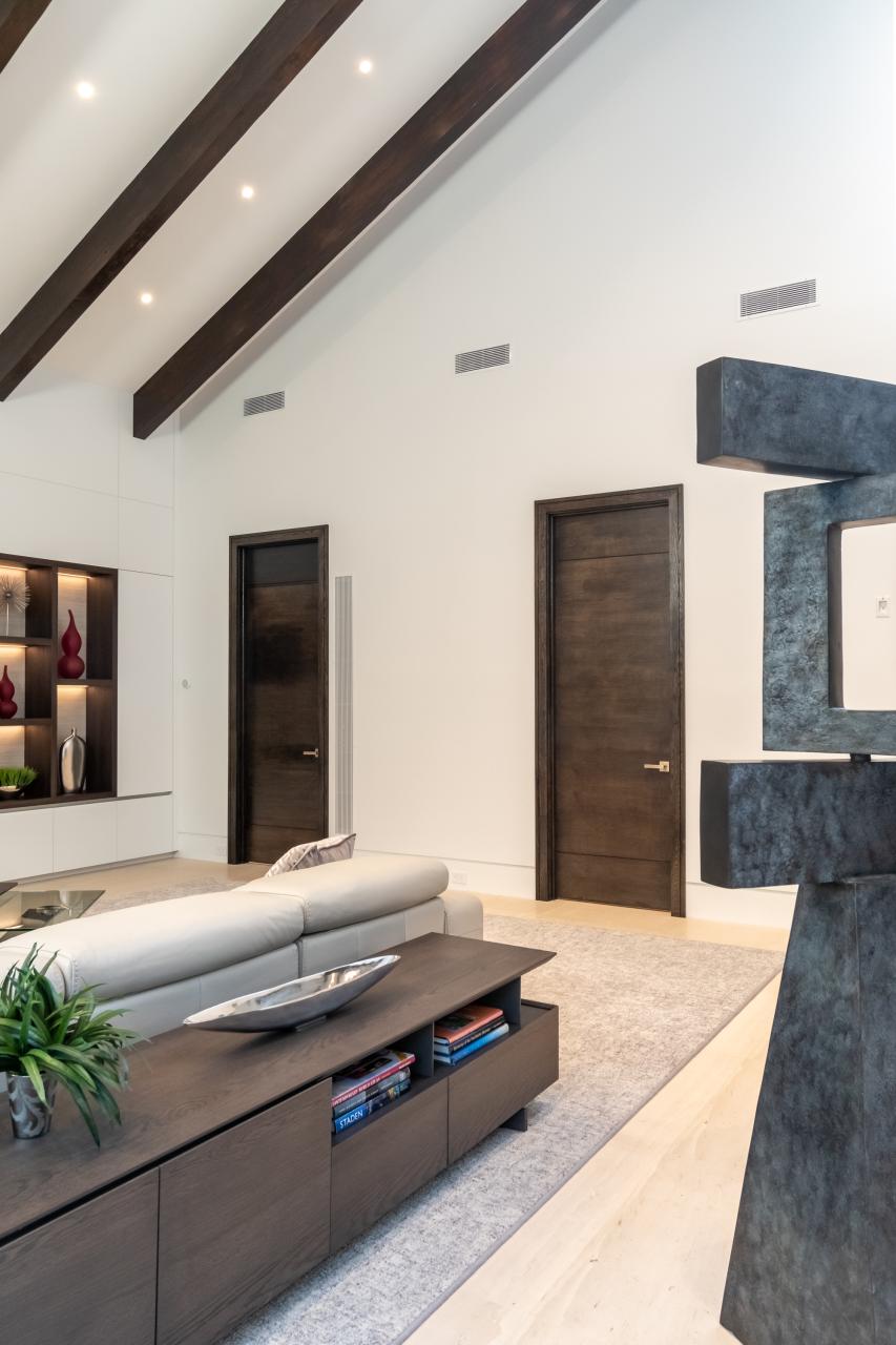 Family room with TMIR3080 doors in quarter sawn white oak with ¼" kerf cut reveals. Builder provided stain finish.