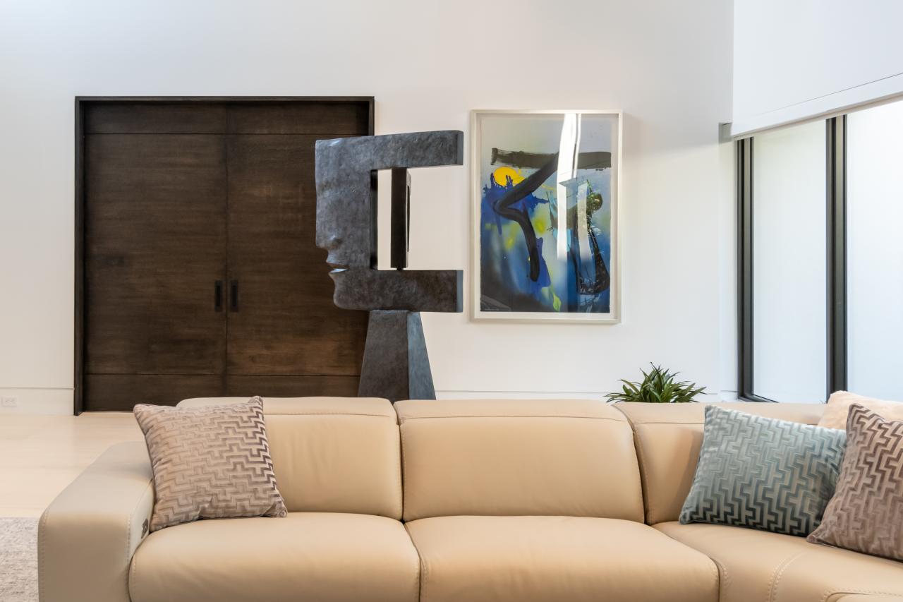 Family room features a pair of TMIR3080 pocket doors in quarter sawn white oak with ¼" kerf cut reveals. Builder provided stain finish.