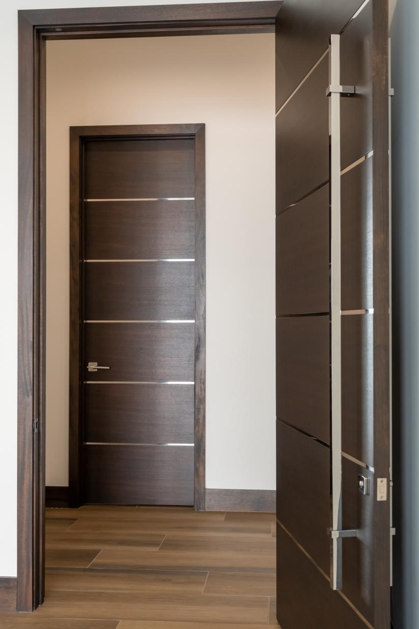 TMIR6000 doors in mahogany with ½" bright stainless steel inlays. Customer stained finish.