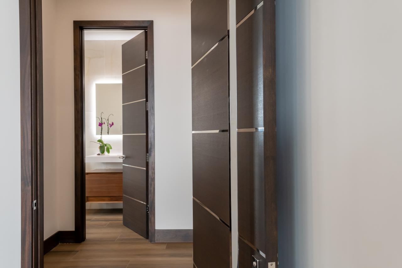 TMIR6000 doors in mahogany with ½" bright stainless steel inlays. Customer stained finish.