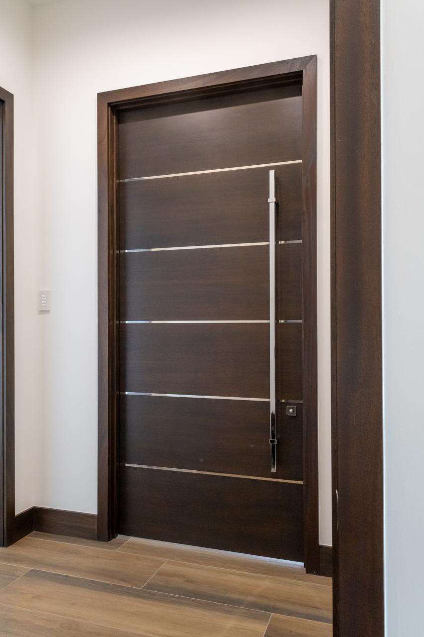 TMIR6000 doors in mahogany with ½" bright stainless steel inlays. Customer stained finish.