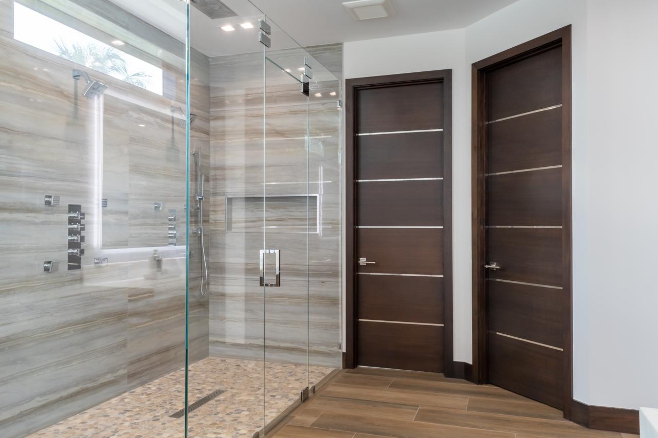 This master bath features TMIR6000 doors in mahogany with ½" bright stainless steel inlay. Builder provided stain finish.