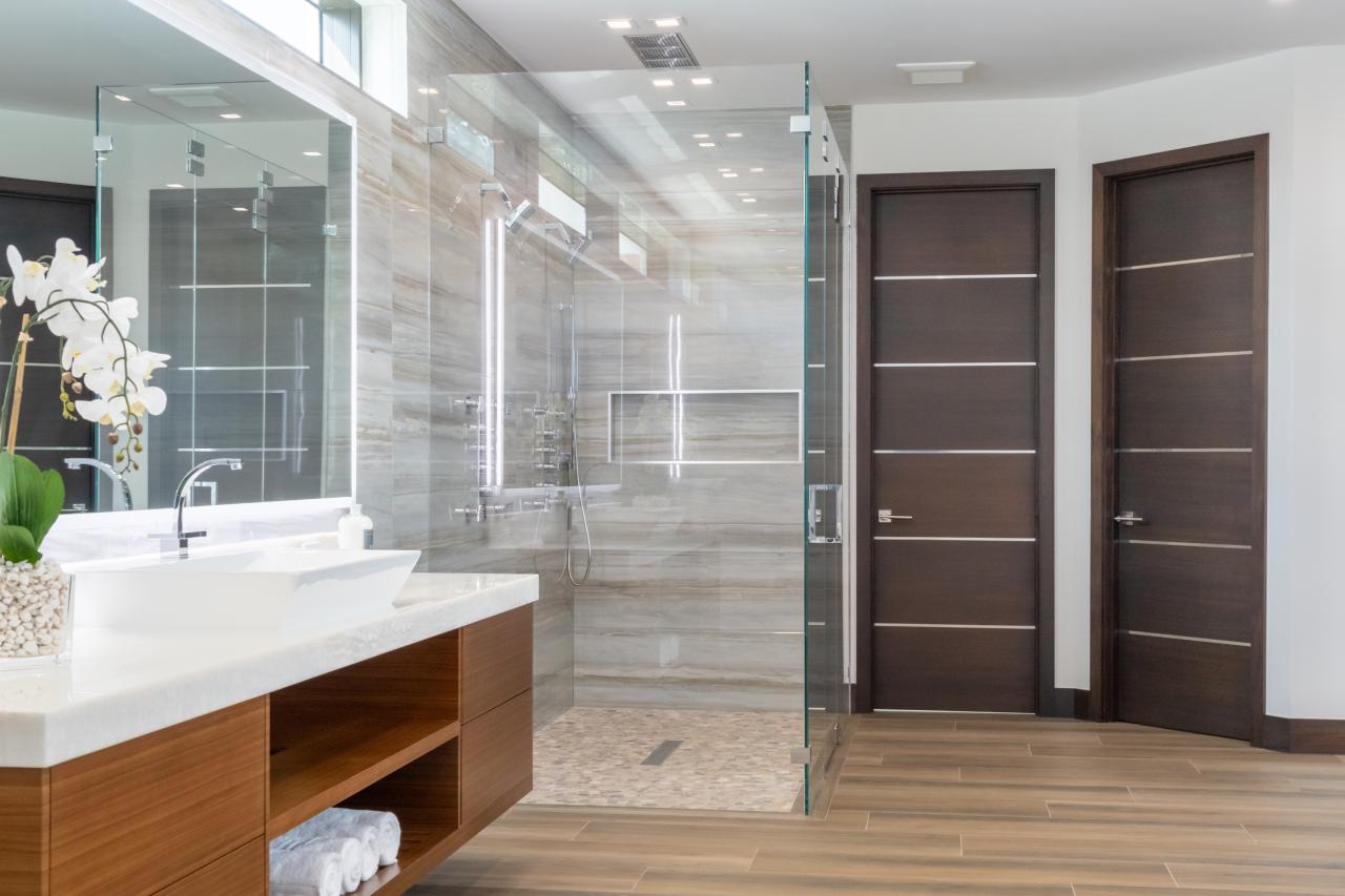 This master bath features TMIR6000 doors in mahogany with ½" bright stainless steel inlay. Builder provided stain finish.