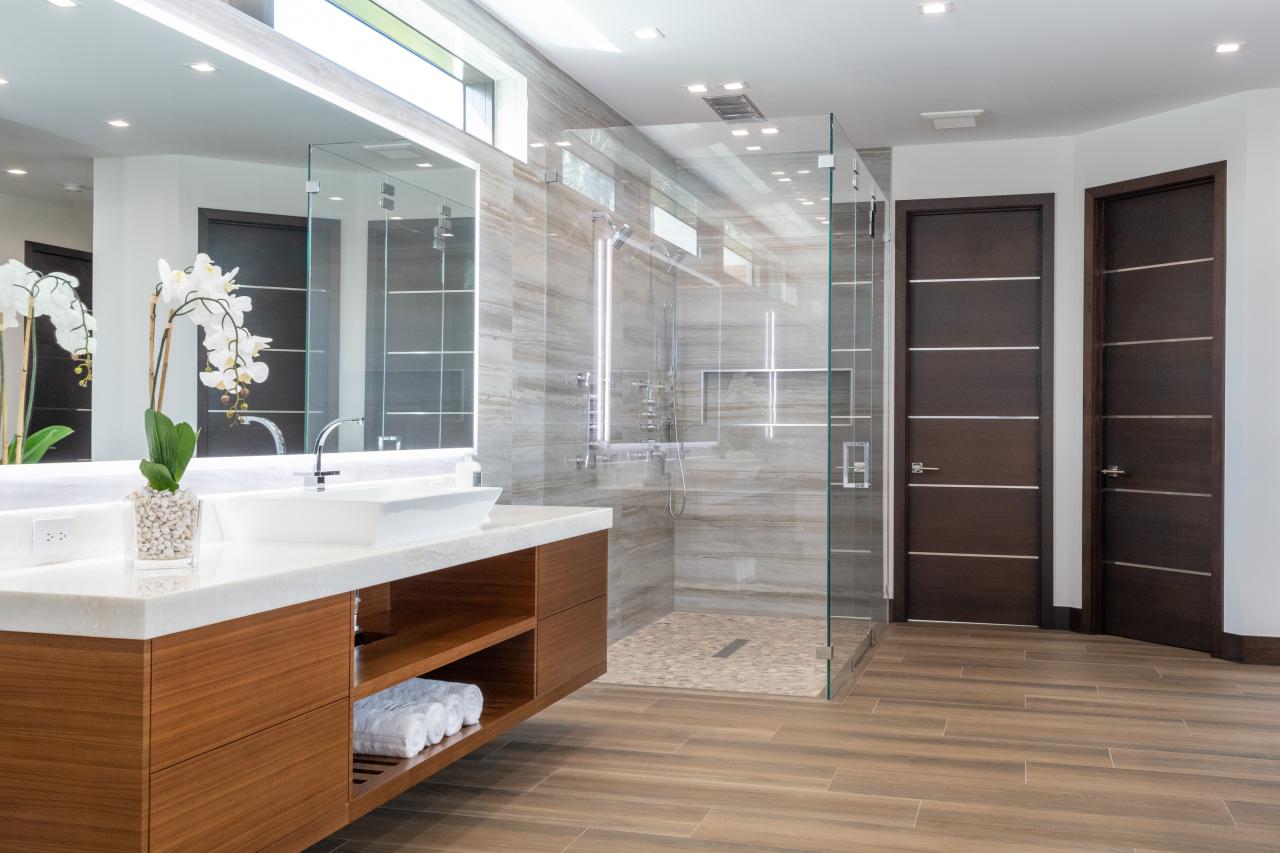 This master bath features TMIR6000 doors in mahogany with ½" bright stainless steel inlay. Builder provided stain finish.