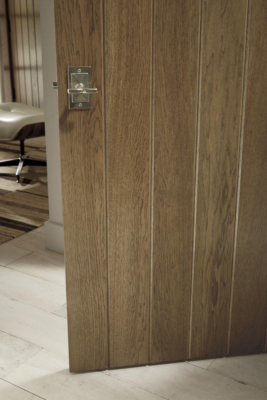 Detail of hickory plank door (VG1000) with wide V-groove profile and Cappuccino handwiped stain