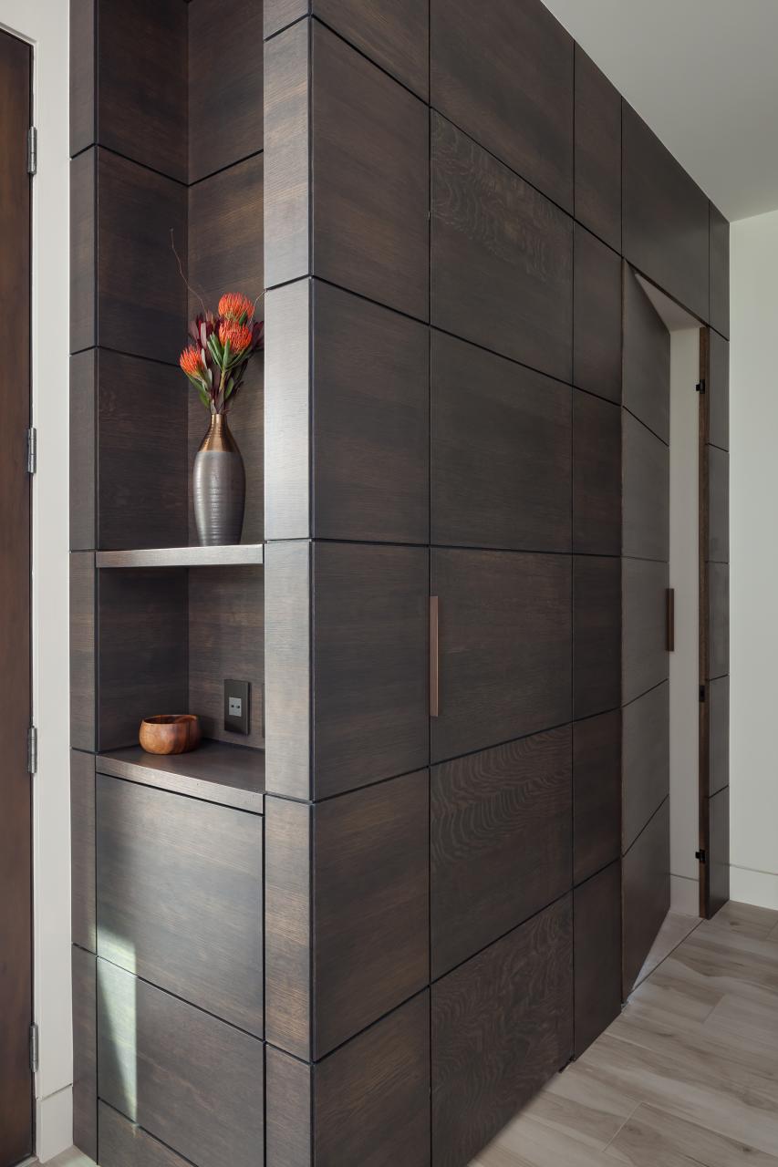 This cabinet features carefully concealed TMIR5000 doors in rift sawn white oak with Espresso stain and ¼" kerf cut reveal