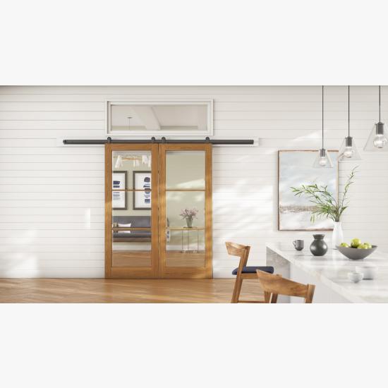 TRG100 transom in paint-grade MDF above a pair of FL300 barn doors in clear pine with Champagne stain and Bevel glass.