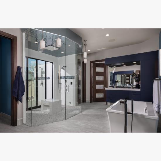 A contemporary master bath features TM9160 doors in walnut with Nutmeg stain and Capiz resin.