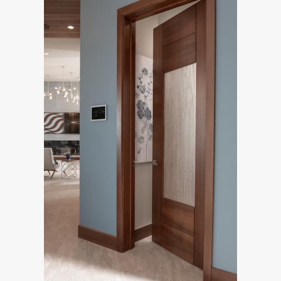 A TM9250 pantry door in walnut with Nutmeg stain and Thatch resin.