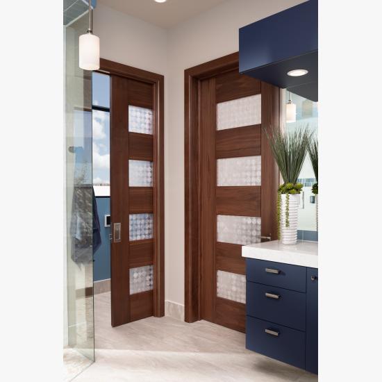 A contemporary master bath features TM9160 doors in walnut with Nutmeg stain and Capiz resin.
