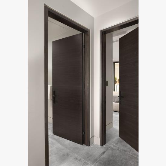 TMF1000 hallway doors in walnut with Ebony stain. Note the kerfed drywall detail around the modern TruStile jambs.