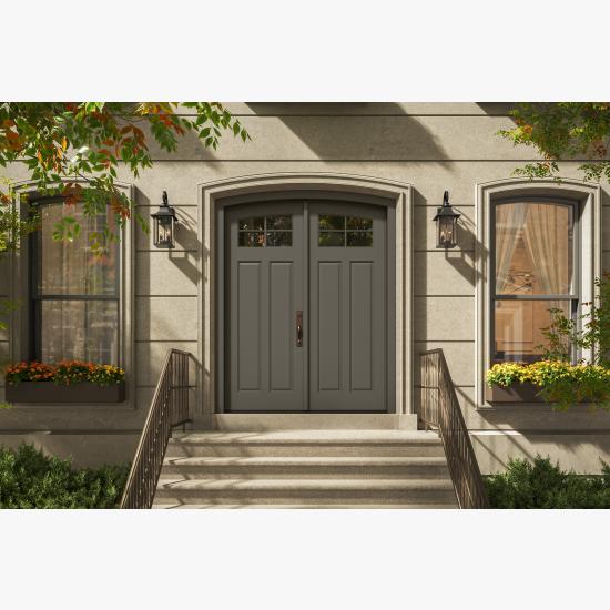 PL254-ES501 Resilient Wood Entry System with Cove & Bead sticking, Scoop panels, and clear glass, featured as a traditional double-door entrance with stone surrounds and decorative lanterns.