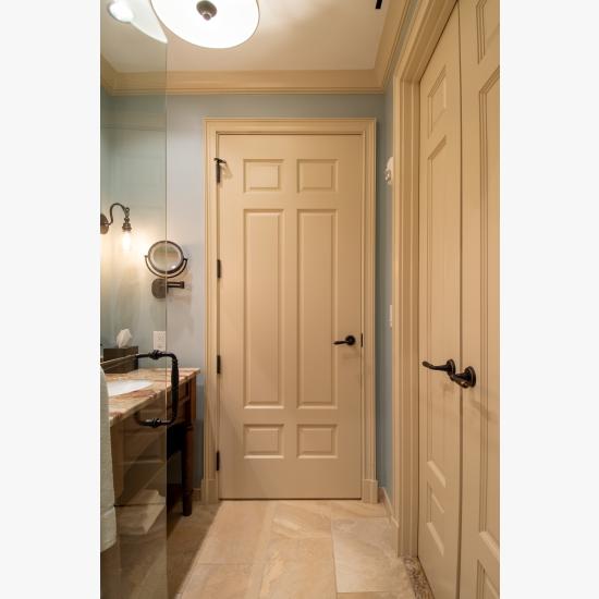 Bathroom with TS650 in MDF with Roman Ogee (OG) sticking and Scoop (B) panel. Pair of TS3100 doors to right.