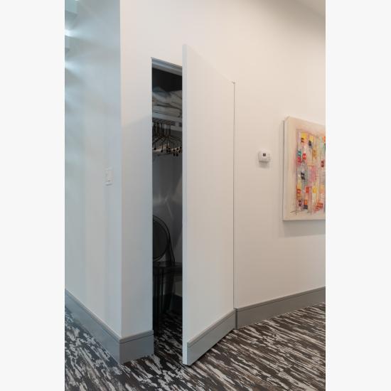 Concealed hinges and jamb allow this TMF1000 closet door in MDF to blend into the wall.