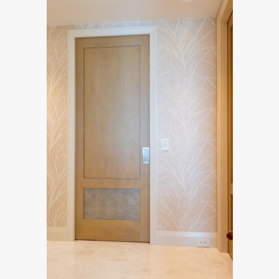 This master bedroom suite features modified TS2210 doors in wire-brushed plain sawn white oak with customer-applied ceruse finish and Shagree Grey Oyster leather.