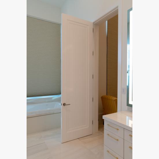This master bath features monumental 10' tall TS1000 doors in MDF with Miracle (MR) moulding and Flat (C) panel.
