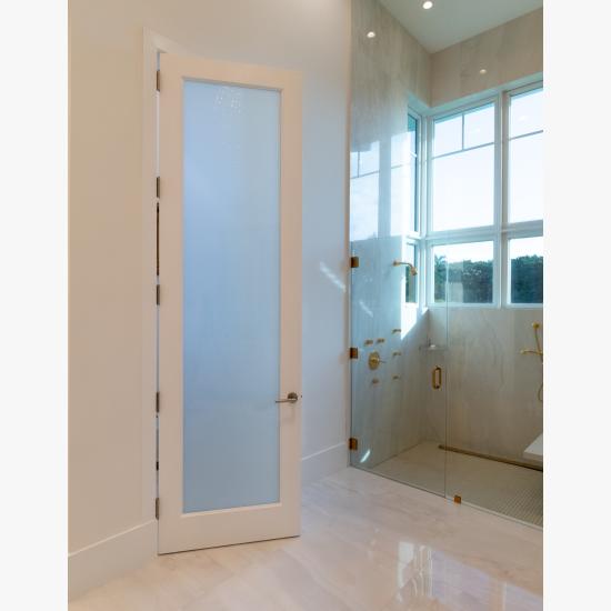 This master bath features 10' tall TS1000 door in MDF with One Step sticking and White Lami glass