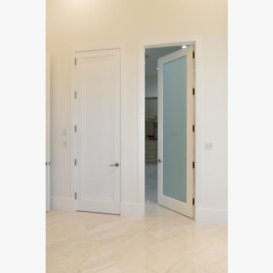 This master bath features 10' tall TS1000 panel doors in MDF with Miracle (MR) moulding and glass doors with One Step sticking and White Lami glass.