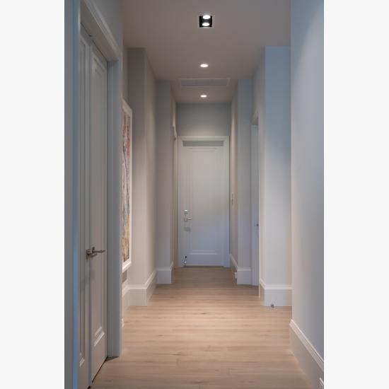 A hallway with TS1000 doors, in MDF with Miracle (MR) moulding and flat (C) panel, leads to the garage.