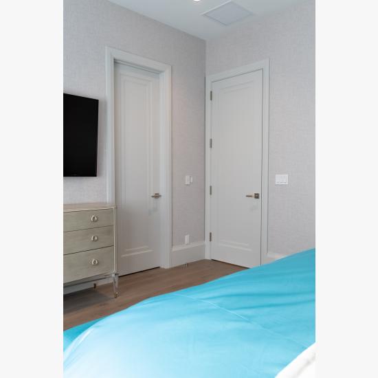 A guest room features TS1000 doors in MDF with Miracle (MR) moulding and Flat (C) panel.