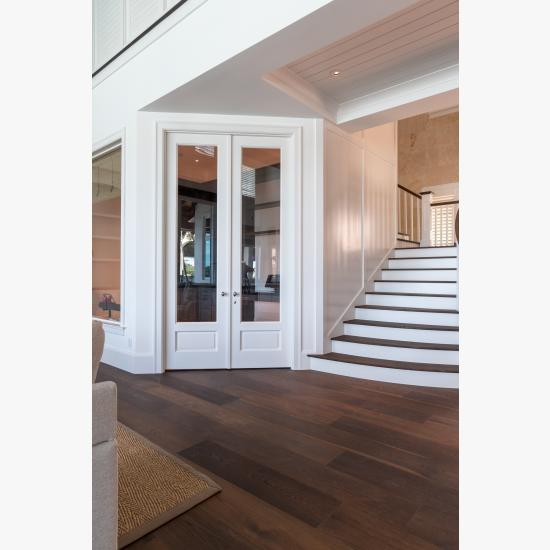 A study next to the living room features a pair of FL110 doors in MDF with Roman Ogee (OG) sticking, Raised (A) panel and clear glass.