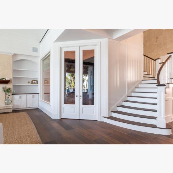 A study next to the living room features a pair of FL110 doors in MDF with Roman Ogee (OG) sticking, Raised (A) panel and clear glass.