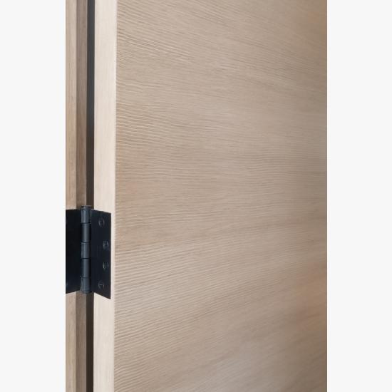 Detail of a TMF1000 flush door in quarter sawn white oak with custom ceruse finish.