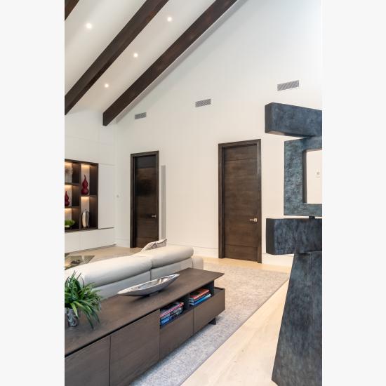 Family room with TMIR3080 doors in quarter sawn white oak with ¼" kerf cut reveals. Builder provided stain finish.