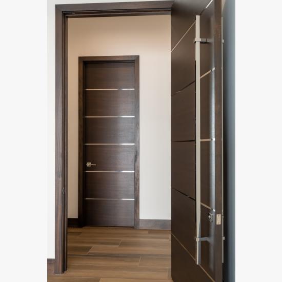 TMIR6000 doors in mahogany with ½" bright stainless steel inlays. Customer stained finish.