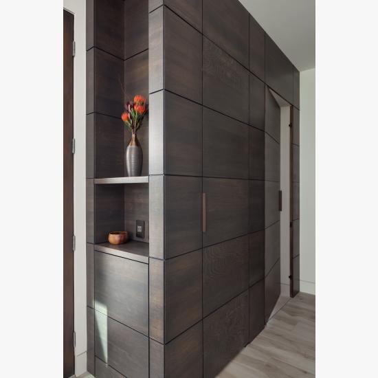 This cabinet features carefully concealed TMIR5000 doors in rift sawn white oak with Espresso stain and ¼" kerf cut reveal