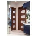 A contemporary master bath features TM9160 doors in walnut with Nutmeg stain and Capiz resin.