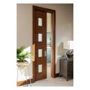 A TM9400 door, in walnut with Nutmeg stain and Frosted glass, divides the bathroom from the rest of this guest suite