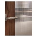 A TM9250 door, in walnut with Nutmeg stain and Groove glass, divides a bathroom from this contemporary study.