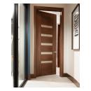 A TM9340 door, in walnut with Nutmeg stain and Shagreen Café Latte leather, opens to a large study which doubles as a guest room.