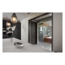 TMF1000 flush barn door, in walnut with Ebony stain, separated the master bath from a walk-in closet.