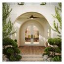 FL430-ES601 Resilient Wood Entry System with Bevel sticking and clear glass, featuring arched double doors in a contemporary stucco entryway with manicured landscaping.