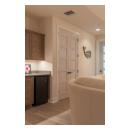 The custom whitewash finish of these birch TM5000 doors ties in with the pastel color scheme of the home.