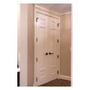 A pair of TS3100 doors in MDF with Roman Ogee sticking and Scoop (B) panel lead to the bathroom suite.
